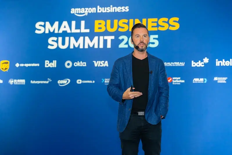 A speaker on stage at the Small Business Summit